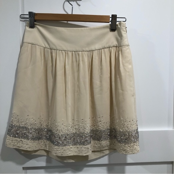 Club Monaco cream mini skirt with gray white beaded trim on bottom. Size 00. - Picture 6 of 6